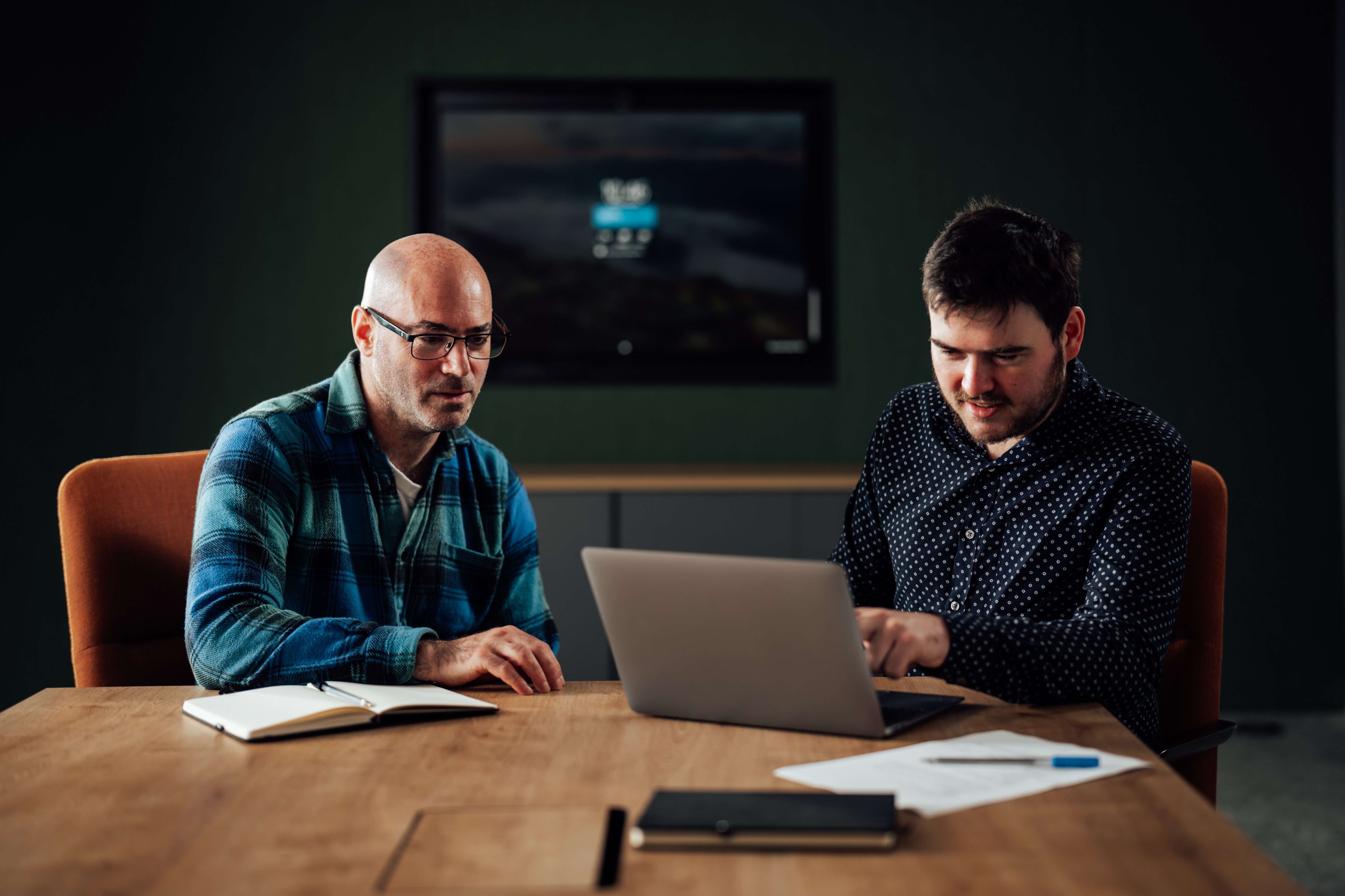 two_guys_watching_laptop