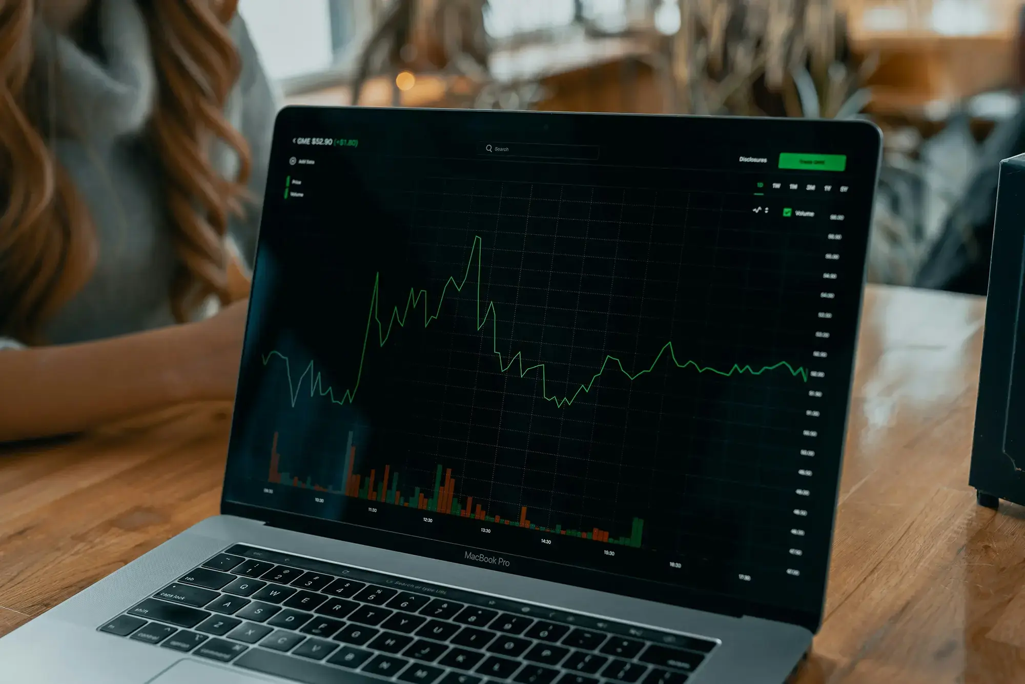 Laptop displays marketing valuations on a graph