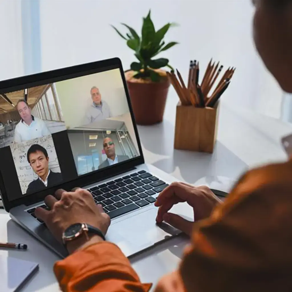 business person working with team on laptop