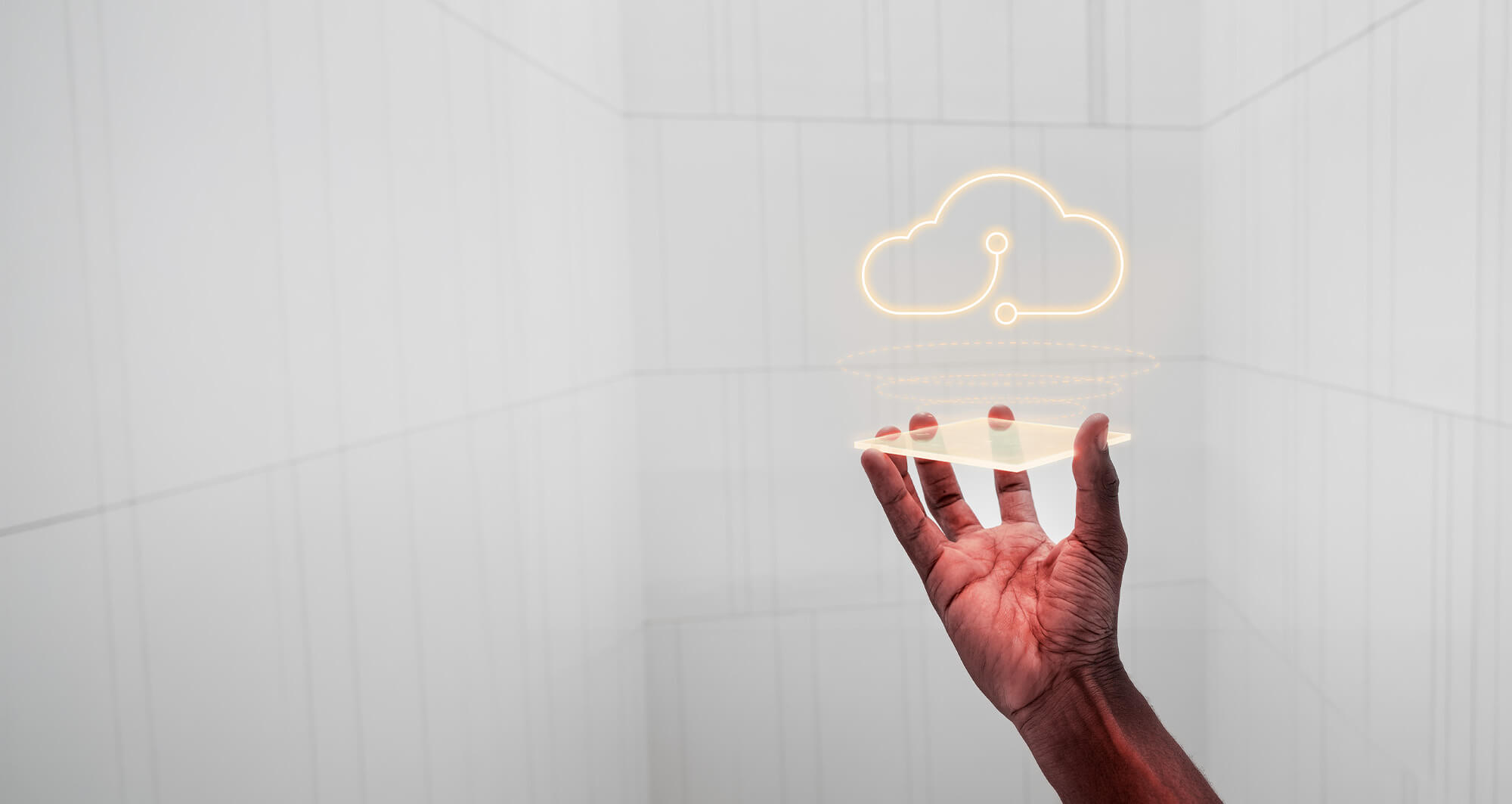 Hand holding a digital interface with a glowing cloud computing icon