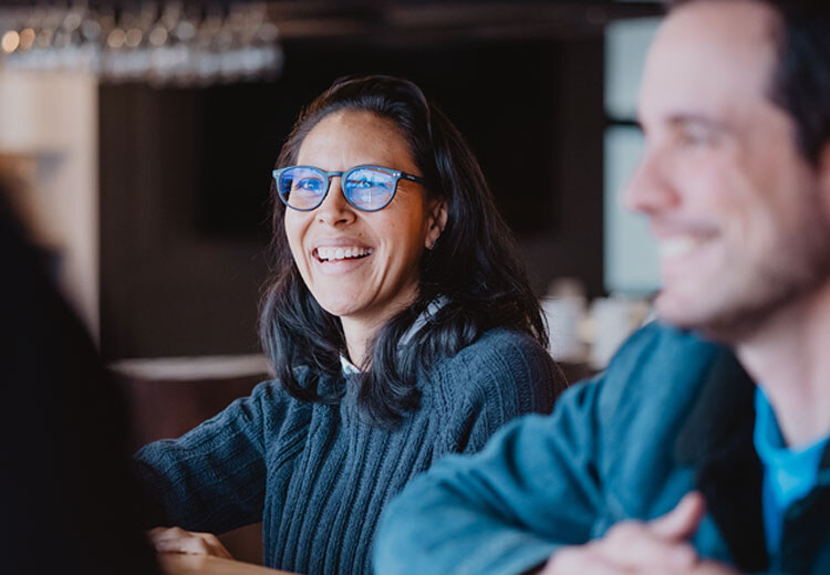 woman working with team at computer screen