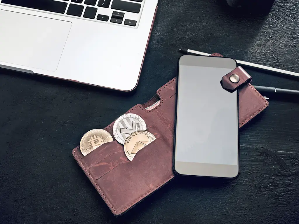 Wallet and mobile phone representing digital payments