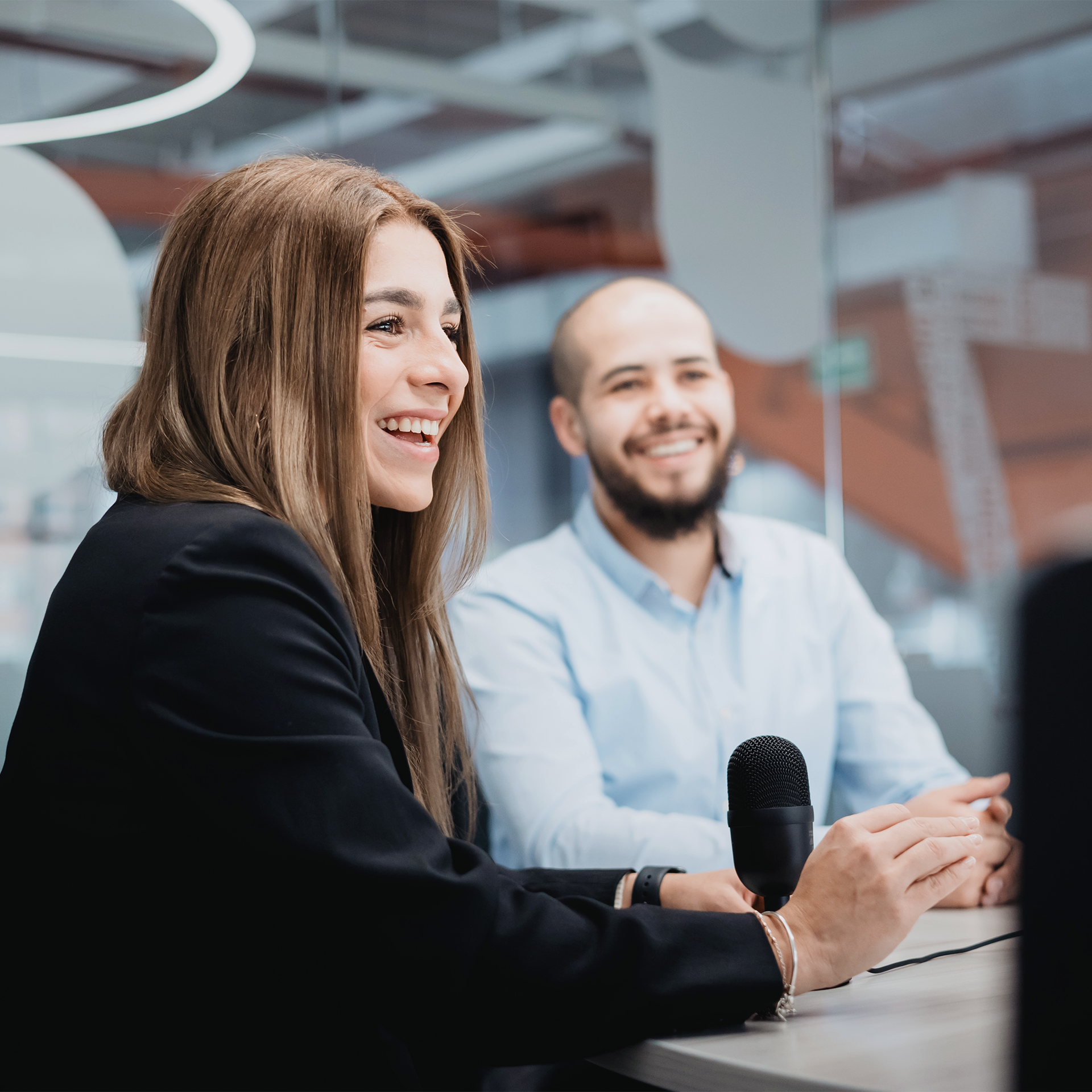 Woman and man discuss software modernisation at work