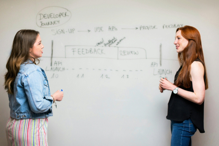 two girls talking in front of each other